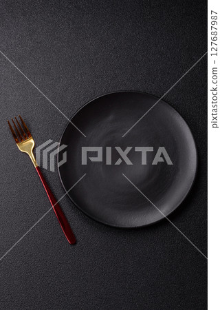 Empty plate with fork, cutlery for dinner table 127687987