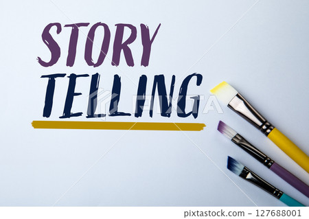 Storytelling Concept with Colorful Paintbrushes on White Background Representing Creativity and 127688001