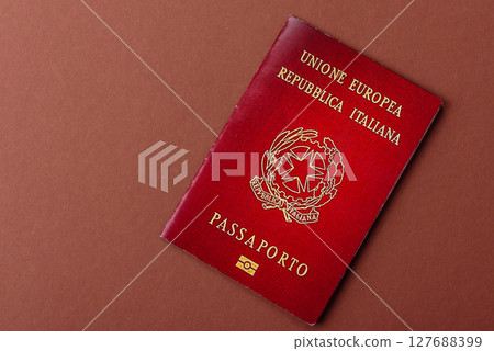 Italy passport for travelling, flying and doing business. Italian document Italy passport for travelling, flying and doing business. Italian document 127688399