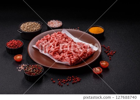 Stuffing or ground raw beef or pork with salt and spices 127688740