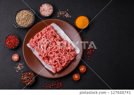 Stuffing or ground raw beef or pork with salt and spices 127688741