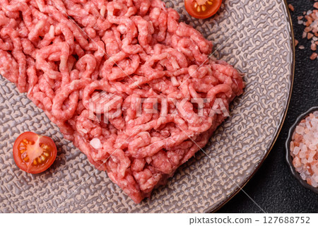 Stuffing or ground raw beef or pork with salt and spices Stuffing or ground raw beef or pork with salt and spices 127688752