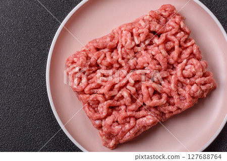 Stuffing or ground raw beef or pork with salt and spices 127688764