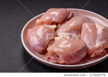 Chicken thigh fillet raw, skinless, boneless, poultry legs 127688779