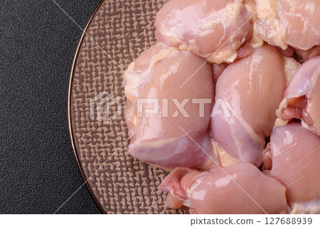 Chicken thigh fillet raw, skinless, boneless, poultry legs 127688939