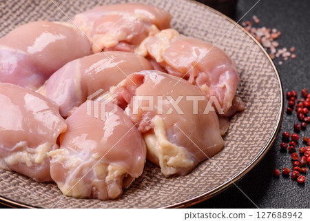 Chicken thigh fillet raw, skinless, boneless, poultry legs 127688942
