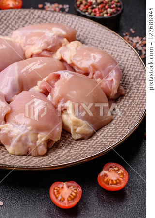 Chicken thigh fillet raw, skinless, boneless, poultry legs Chicken thigh fillet raw, skinless, boneless, poultry legs 127688945