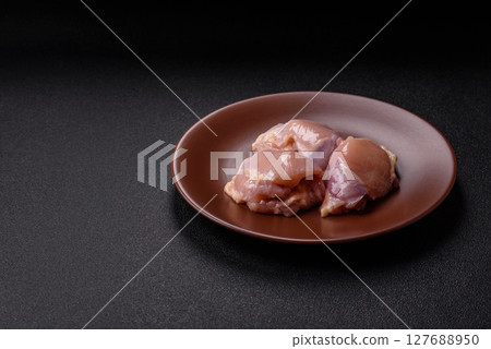 Chicken thigh fillet raw, skinless, boneless, poultry legs Chicken thigh fillet raw, skinless, boneless, poultry legs 127688950