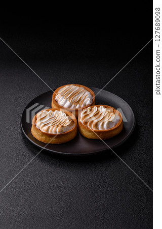 Lemon tart, meringue pie or fruit cream tart Lemon tart, meringue pie or fruit cream tart 127689098