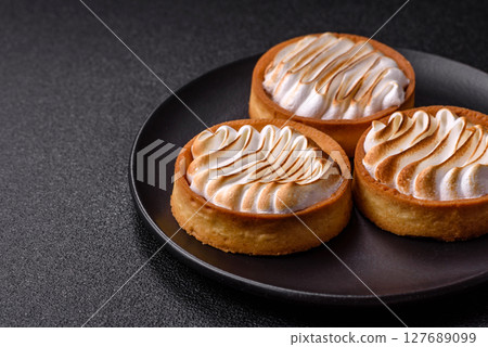 Lemon tart, meringue pie or fruit cream tart Lemon tart, meringue pie or fruit cream tart 127689099