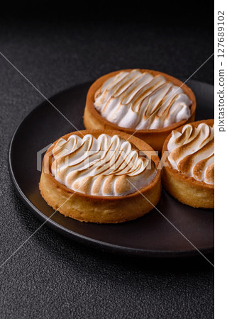 Lemon tart, meringue pie or fruit cream tart 127689102