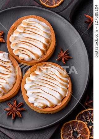 Lemon tart, meringue pie or fruit cream tart Lemon tart, meringue pie or fruit cream tart 127689104