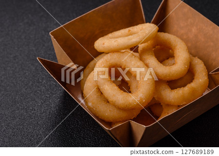 Onion rings or squid rings fries crispy, savory with sauce Onion rings or squid rings fries crispy, savory with sauce 127689189