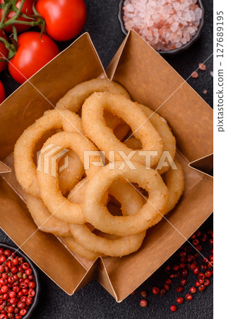 Onion rings or squid rings fries crispy, savory with sauce Onion rings or squid rings fries crispy, savory with sauce 127689195