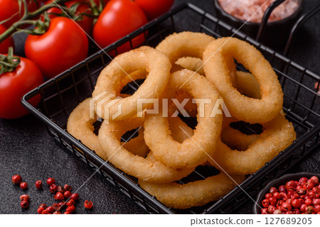 Onion rings or squid rings fries crispy, savory with sauce Onion rings or squid rings fries crispy, savory with sauce 127689205