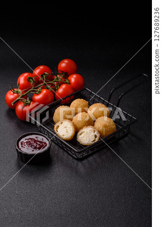 Cheese fried balls or croquettes with potatoes or rice Cheese fried balls or croquettes with potatoes or rice 127689236