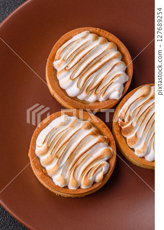 Lemon tart, meringue pie or fruit cream tart Lemon tart, meringue pie or fruit cream tart 127689254