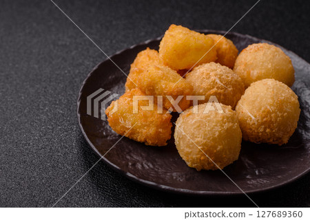 Fried mozzarella or brie cheese with cranberry or raspberry sauce Fried mozzarella or brie cheese with cranberry or raspberry sauce 127689360