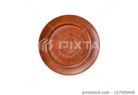 Empty ceramic plate on a monochrome brown background Empty ceramic plate on a monochrome brown background 127689499