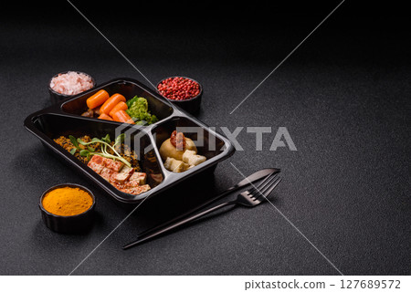 Food bowl with tofu, quinoa, broccoli and carrots, microgreens 127689572