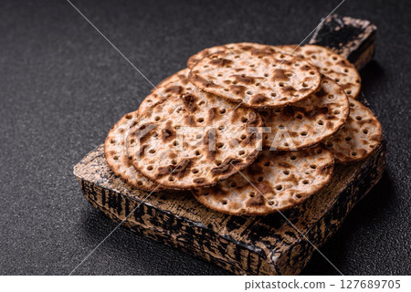 Matzah wheat bread for the Jewish holiday of passover. Kosher matzo bread Matzah wheat bread for the Jewish holiday of passover. Kosher matzo bread 127689705
