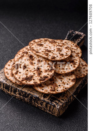 Matzah wheat bread for the Jewish holiday of passover. Kosher matzo bread Matzah wheat bread for the Jewish holiday of passover. Kosher matzo bread 127689708