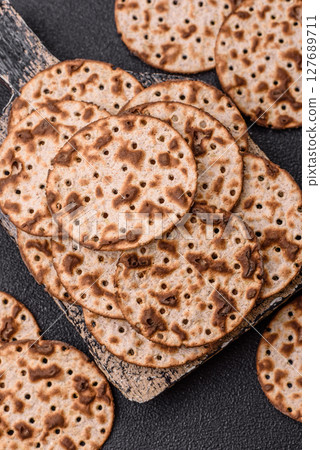 Matzah wheat bread for the Jewish holiday of passover. Kosher matzo bread Matzah wheat bread for the Jewish holiday of passover. Kosher matzo bread 127689711