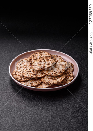 Matzah wheat bread for the Jewish holiday of passover. Kosher matzo bread Matzah wheat bread for the Jewish holiday of passover. Kosher matzo bread 127689720