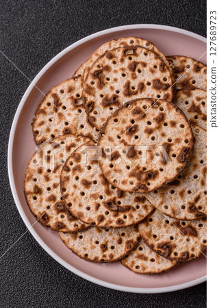 Matzah wheat bread for the Jewish holiday of passover. Kosher matzo bread Matzah wheat bread for the Jewish holiday of passover. Kosher matzo bread 127689723