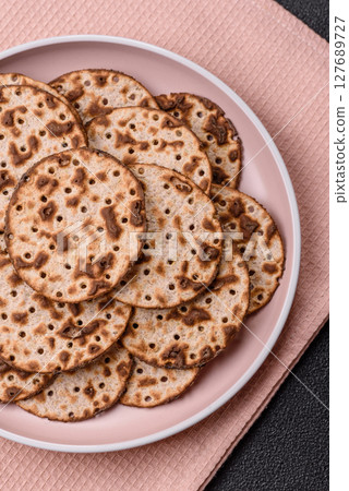 Matzah wheat bread for the Jewish holiday of passover. Kosher matzo bread 127689727