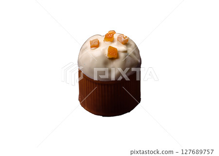 Easter sweet cake covered with icing with fruit and candied fruits 127689757