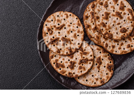 Matzah wheat bread for the Jewish holiday of passover. Kosher matzo bread Matzah wheat bread for the Jewish holiday of passover. Kosher matzo bread 127689836