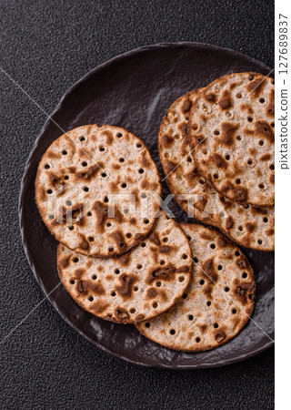 Matzah wheat bread for the Jewish holiday of passover. Kosher matzo bread Matzah wheat bread for the Jewish holiday of passover. Kosher matzo bread 127689837