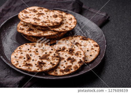 Matzah wheat bread for the Jewish holiday of passover. Kosher matzo bread Matzah wheat bread for the Jewish holiday of passover. Kosher matzo bread 127689839