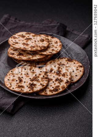 Matzah wheat bread for the Jewish holiday of passover. Kosher matzo bread Matzah wheat bread for the Jewish holiday of passover. Kosher matzo bread 127689842