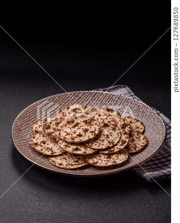 Matzah wheat bread for the Jewish holiday of passover. Kosher matzo bread Matzah wheat bread for the Jewish holiday of passover. Kosher matzo bread 127689850