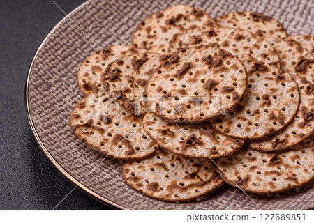 Matzah wheat bread for the Jewish holiday of passover. Kosher matzo bread Matzah wheat bread for the Jewish holiday of passover. Kosher matzo bread 127689851