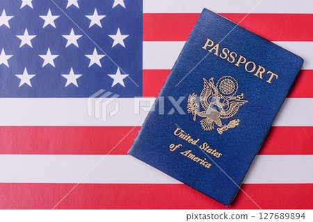 American passport against the background of the US national flag 127689894
