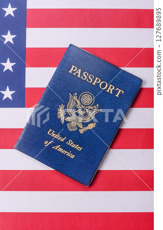 American passport against the background of the US national flag 127689895
