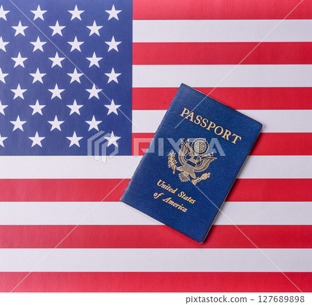 American passport against the background of the US national flag American passport against the background of the US national flag 127689898