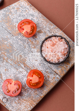 Empty wooden cutting board on a monochrome brown background Empty wooden cutting board on a monochrome brown background 127690025