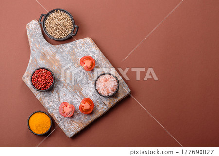 Empty wooden cutting board on a monochrome brown background Empty wooden cutting board on a monochrome brown background 127690027
