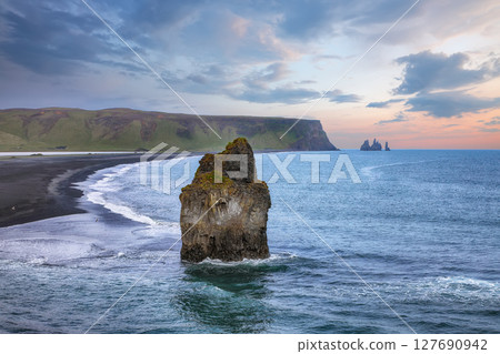 Impressive view of Kirkjufjara black sand beach from Dyrholaey promontory on Atlantic South Coast. Impressive view of Kirkjufjara black sand beach from Dyrholaey promontory on Atlantic South Coast. 127690942