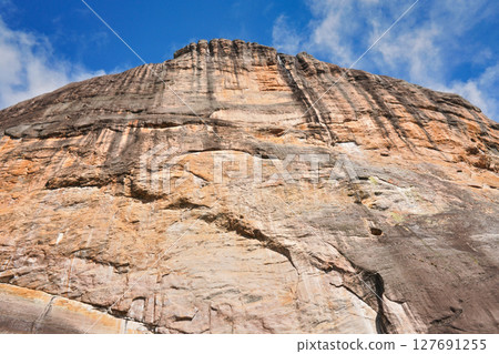 Looking up tall Andringitra massif rock as seen during trek to Pic Boby peak 127691255