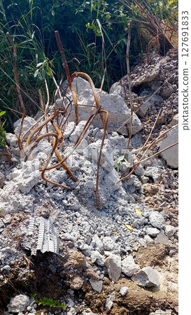 Construction Debris Scattered in an Open Area After Demolition Activities Near a Site in Daylight Construction Debris Scattered in an Open Area After Demolition Activities Near a Site in Daylight 127691833