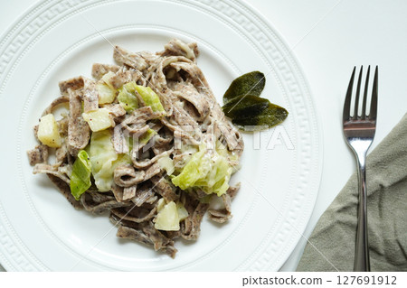 Italian buckwheat pasta, pizzoccheri (with potatoes, cabbage and cheese) 127691912