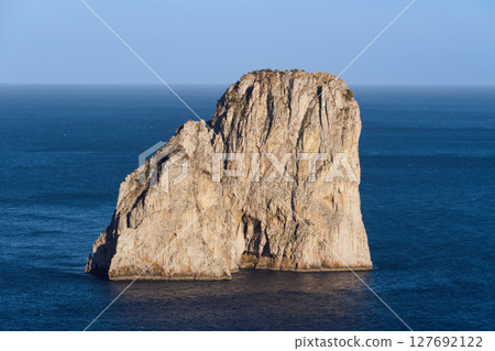 Beautiful view of Faraglioni rocks near Capri Island. Beautiful view of Faraglioni rocks near Capri Island. 127692122