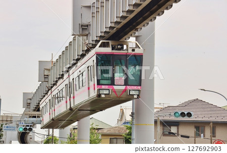 Shonan Monorail running through a residential area Shonan Monorail running through a residential area 127692903