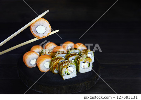 Assorted japanese sushi food. Sushi roll Philadelphia with salmon 127693131