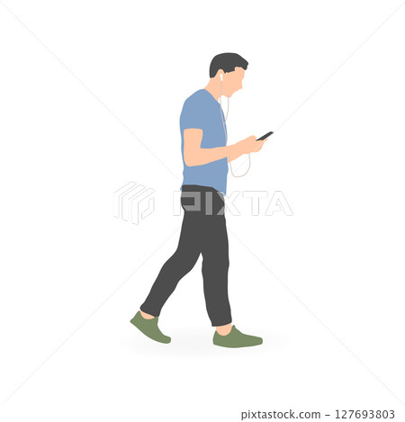 A young man walking while looking at his smartphone A young man walking while looking at his smartphone 127693803